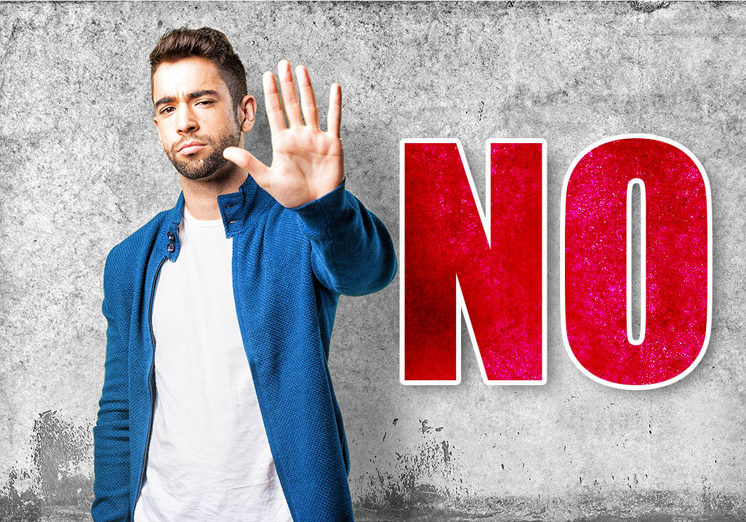 young man doing a stop gesture